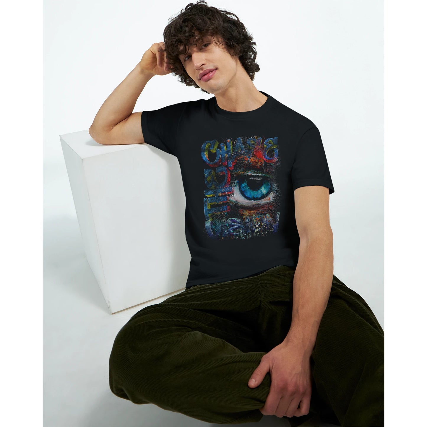 Chase the Vision Black t-shirt showcasing a vibrant eye design with an explosion of color, symbolizing creativity and focus from the Limited Edition Collection, worn by male model five.